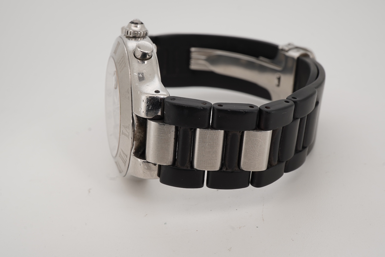 A gentleman's stainless steel Cartier 21 Chronoscaph wrist watch, the black face with three subsidiary dials, date aperture and baton numerals